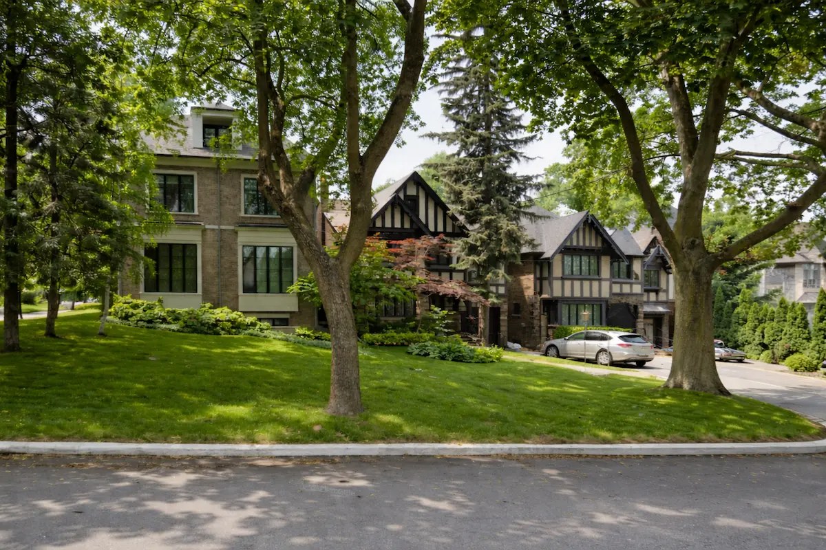 Tudor-style detached homes on a tree-lined York district street in Toronto